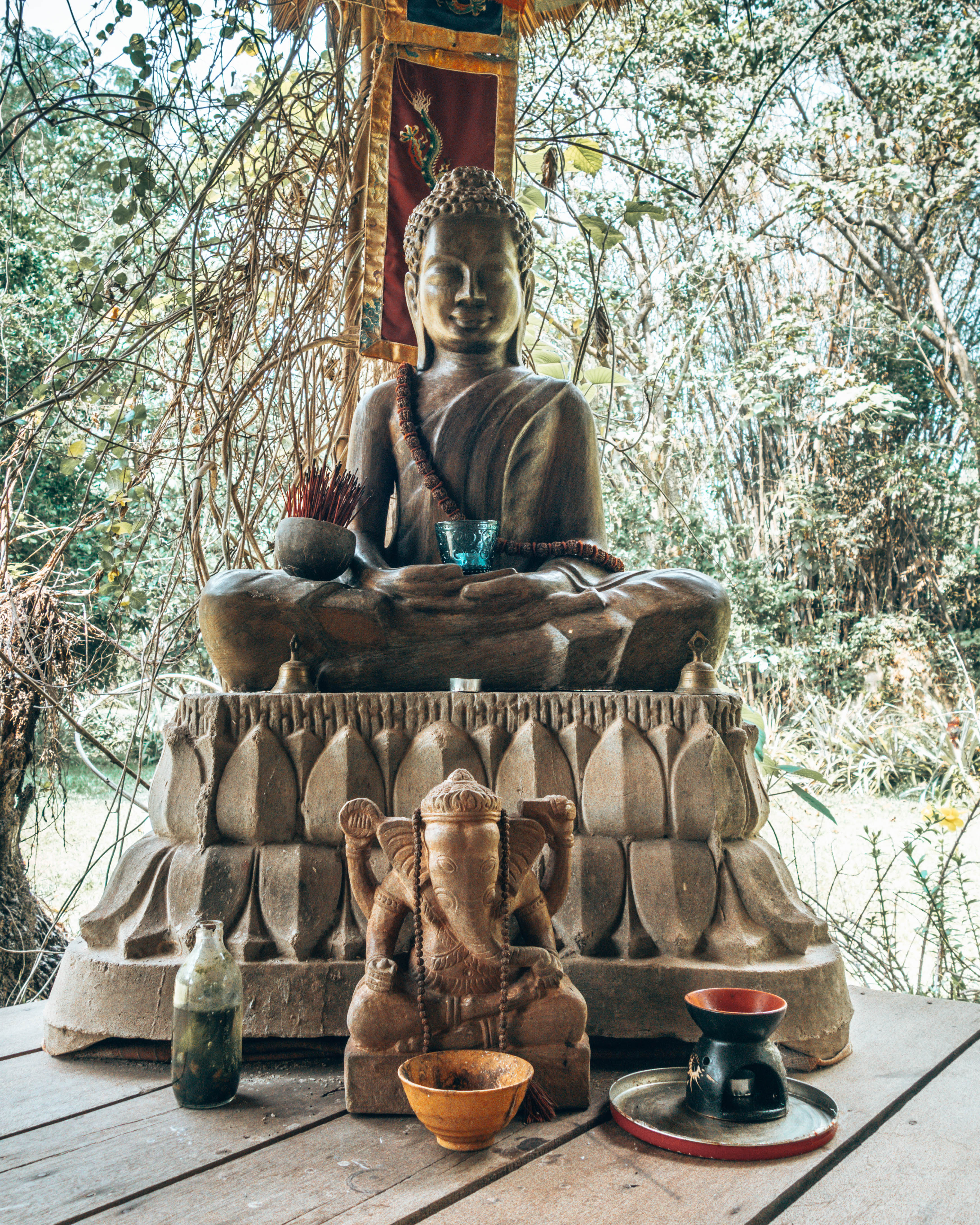 Buddha statue at the yoga retreat in Siem Reap - Off-the-beaten-path guide - WeDidItOurWay.com