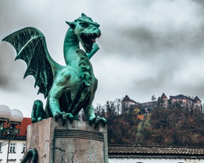 A dragon statue from the Dragon Bridge in front of the Ljubljana Castle, Slovenia