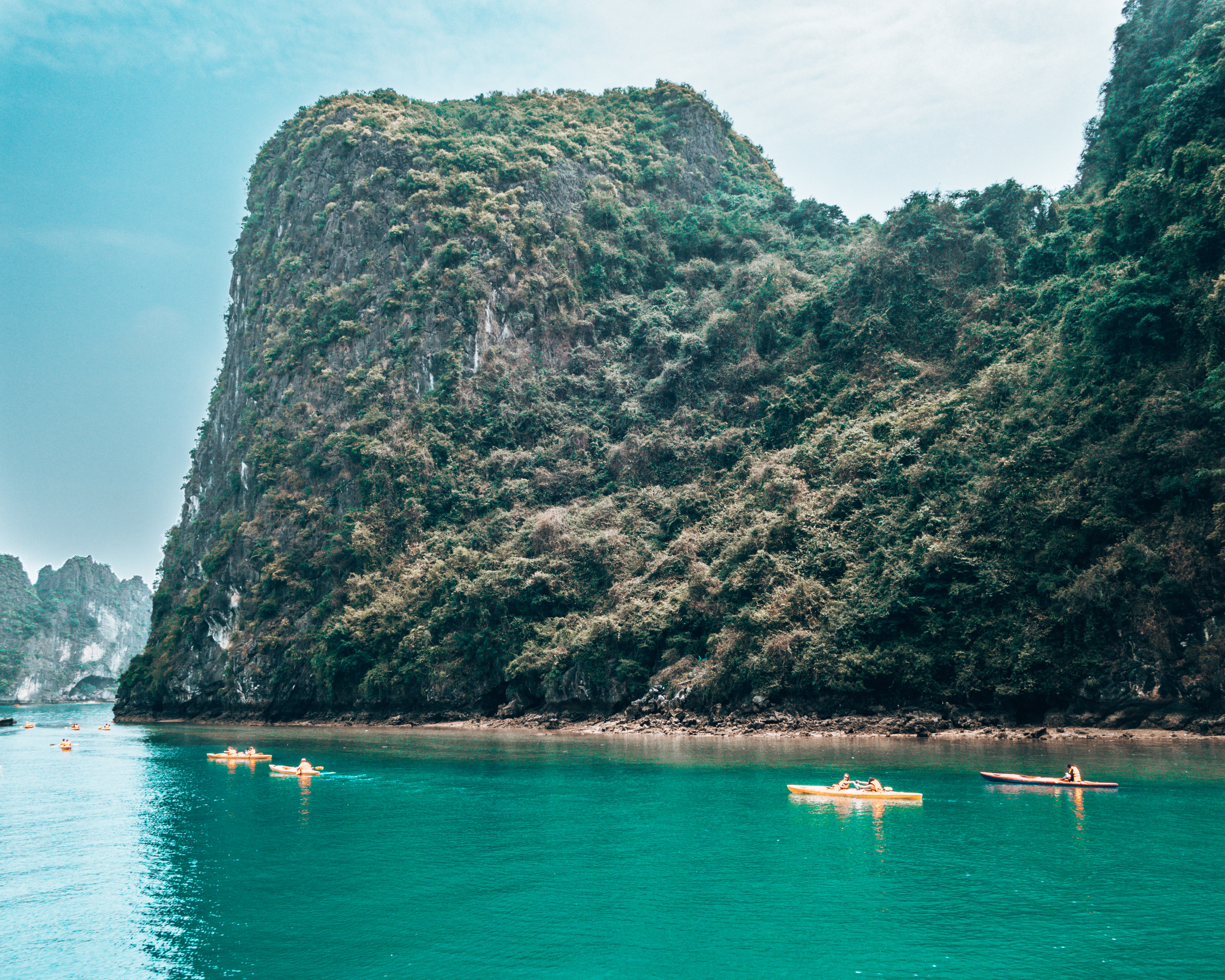 Tourists kayaking in Halong Bay Vietnam