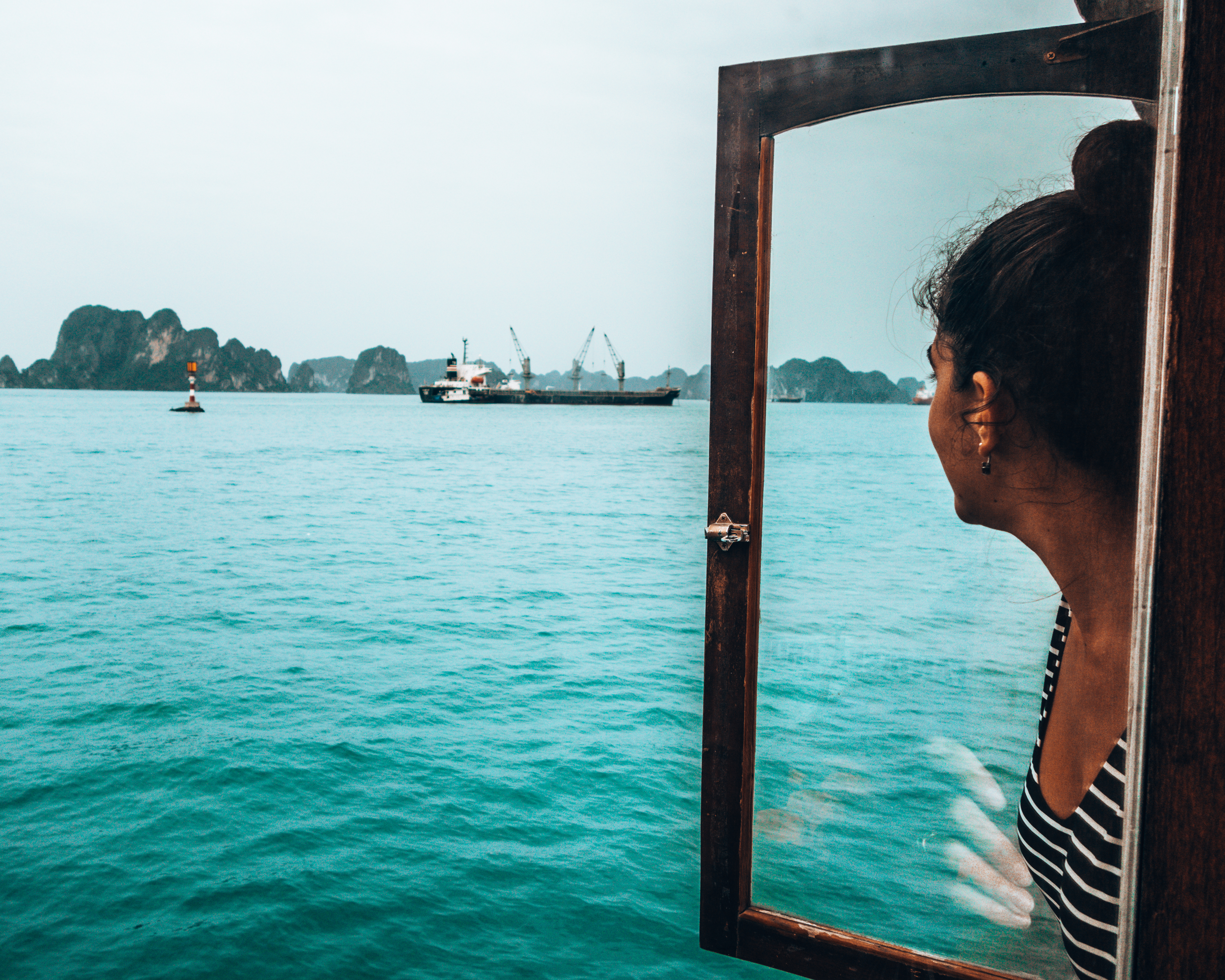 Carine gazing out the boat in Halong Bay Vietnam